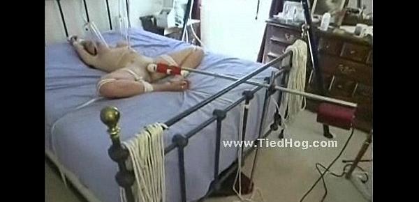  Whore tied in bed immobilized in rope